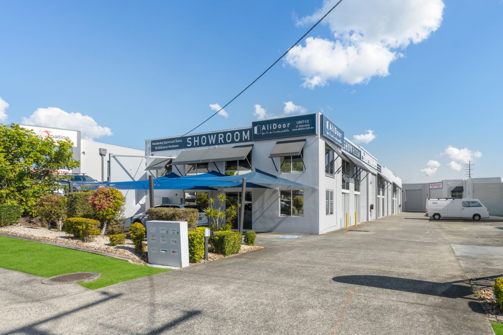 Street-facing showroom and driveway at the Ramly Drive industrial complex